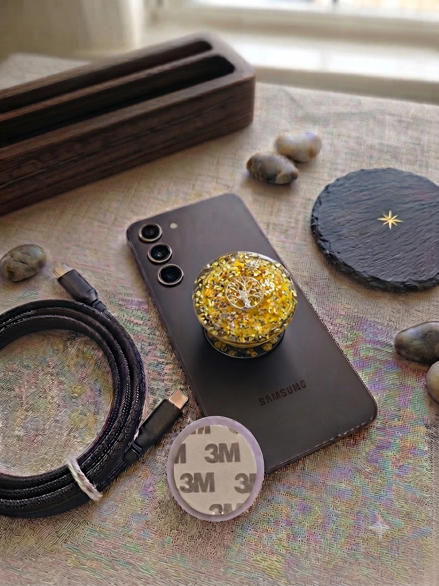 Gold Tree of Life resin pop socket close up showing golden glitter and Tree of Life charm with slate coaster